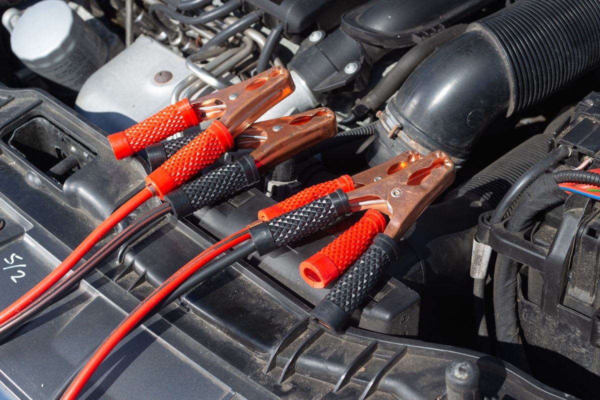 Jumper cables on a car battery